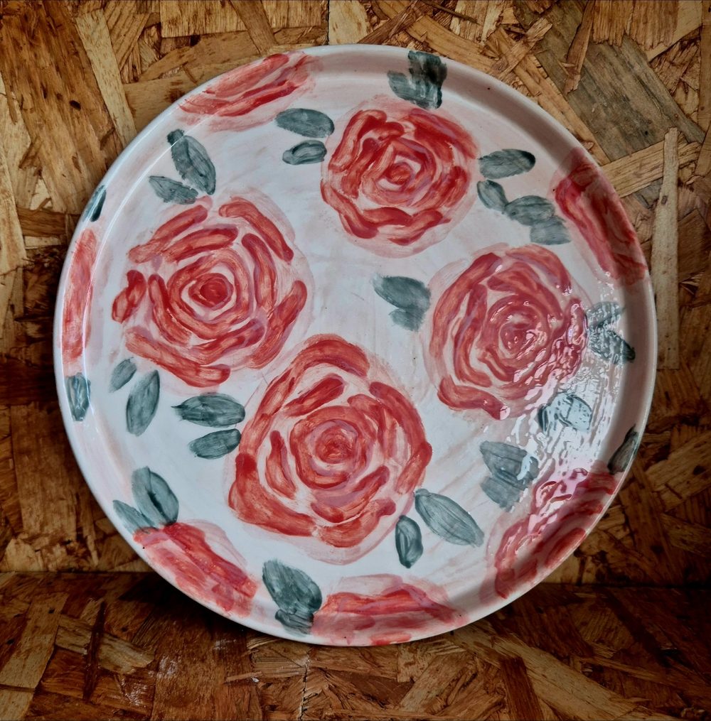 Plate painted with red roses